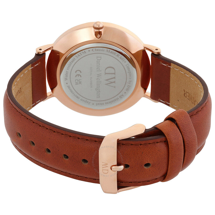 Daniel Wellington watch case back showing rose gold case and cognac leather strap with buckle