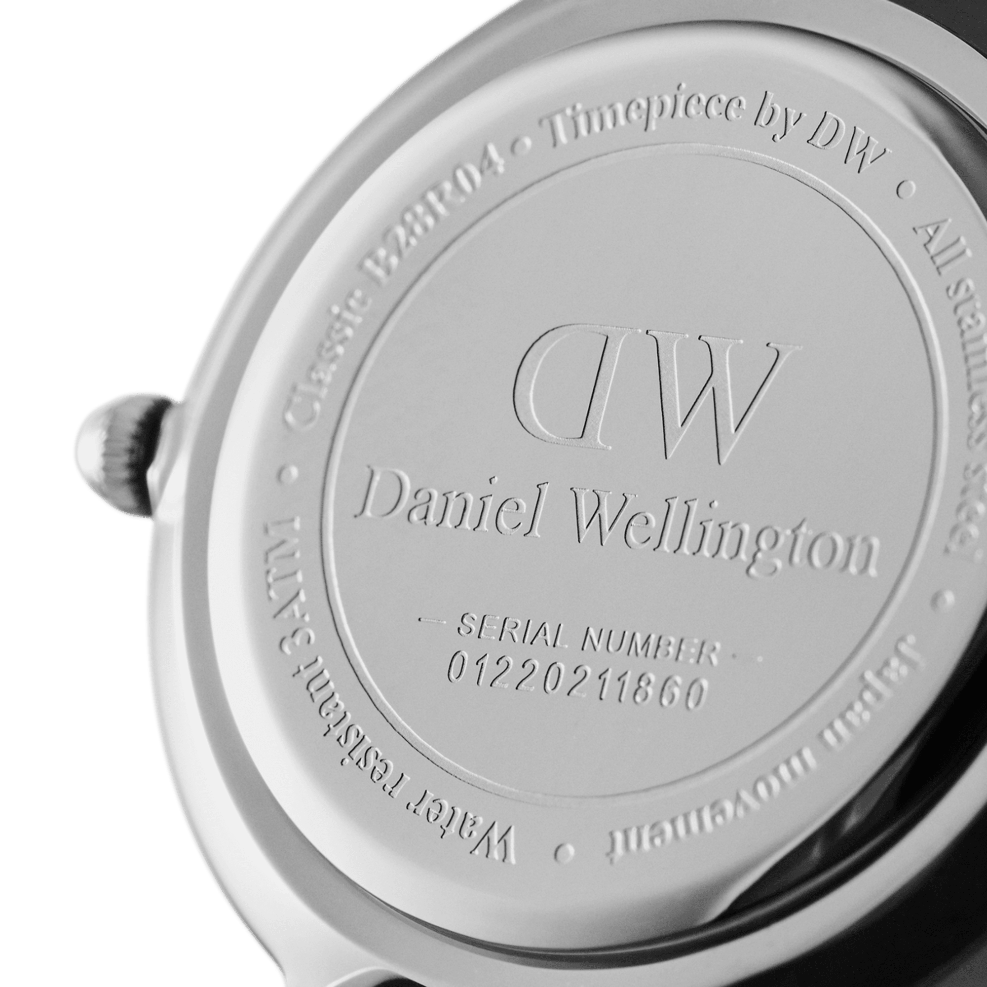 Silver caseback with DW branding and serial number engraving