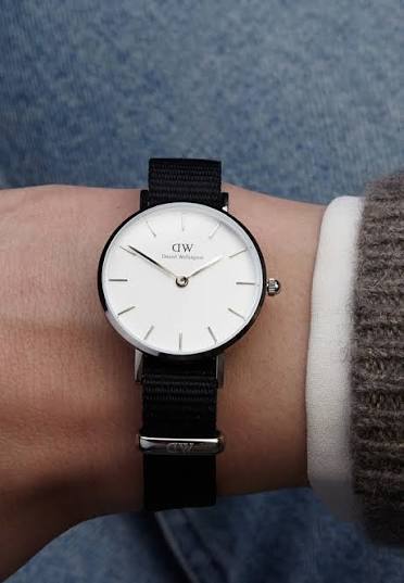 Daniel Wellington Classic Petite Cornwall watch worn on wrist with black nylon strap
