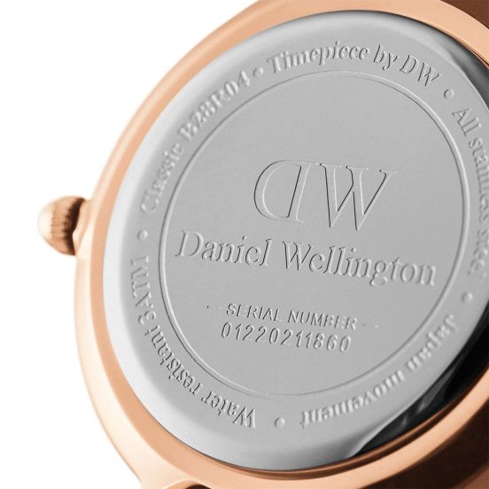 Rose gold caseback engraved with DW branding and serial number 04220211660