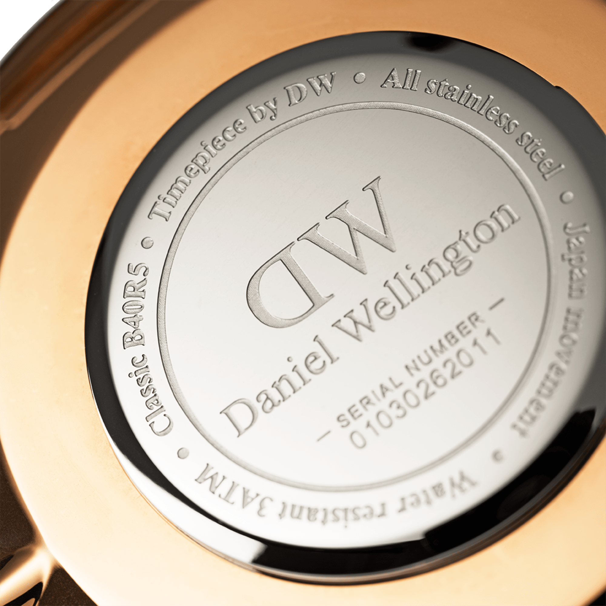 Case back showing stainless steel case engraved with Daniel Wellington branding and serial number