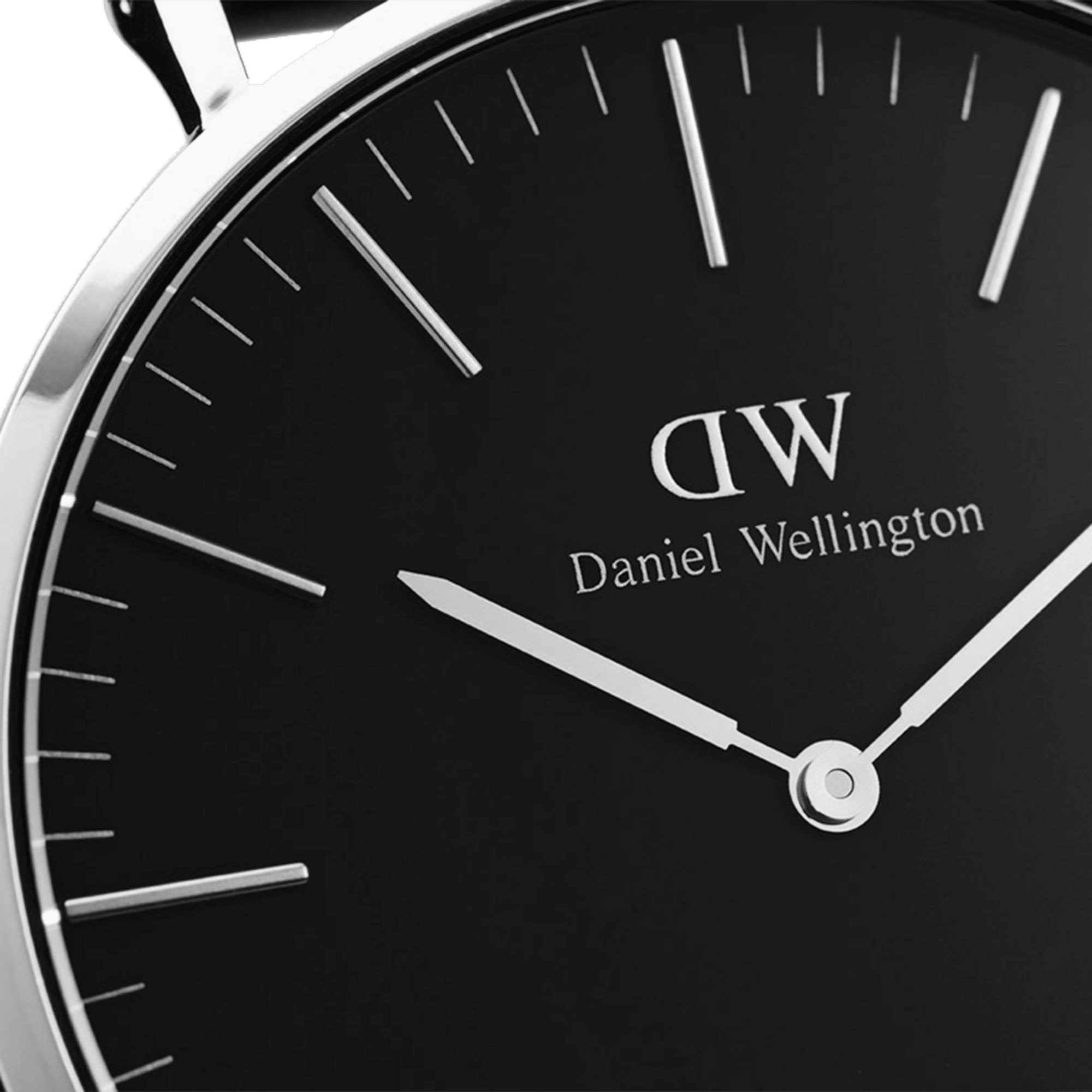 Close-up of black dial with DW logo, Daniel Wellington text, silver hour markers and hands