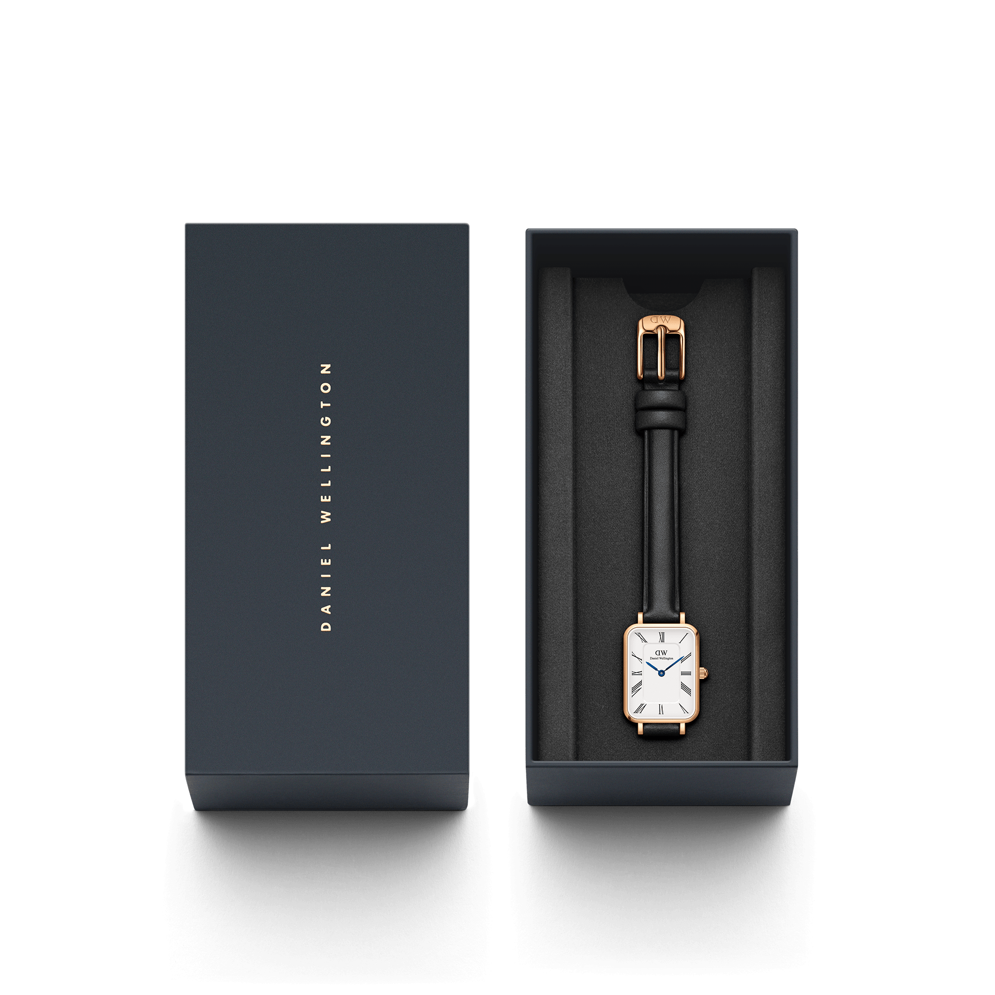 Daniel Wellington watch packaging with dark box and rose gold rectangular watch with black strap
