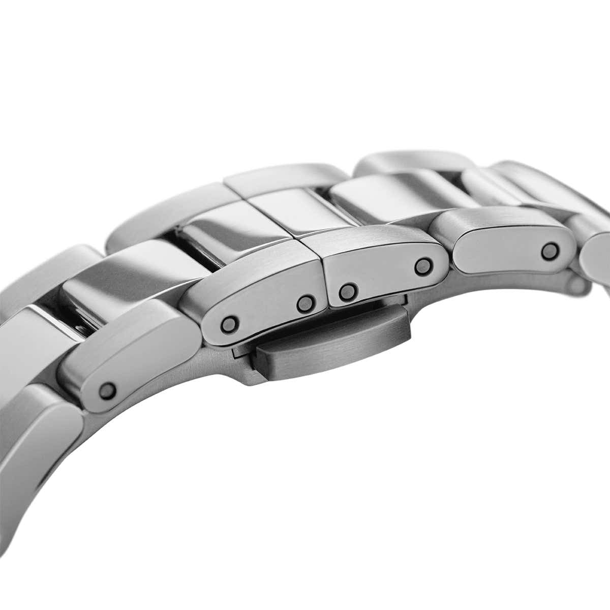 Close-up of link bracelet showing metal links with fold-over clasp mechanism