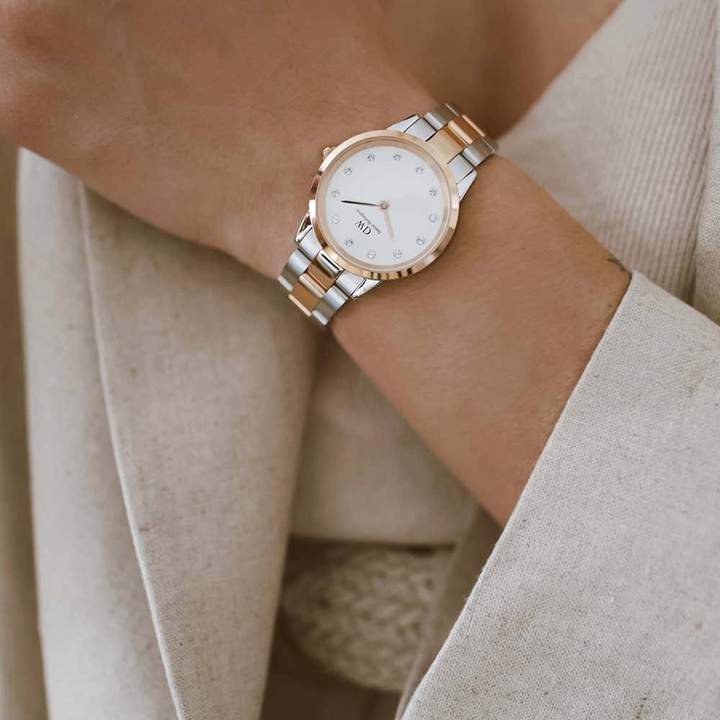Iconic Link Lumine 28mm watch on wrist, styled with neutral clothing