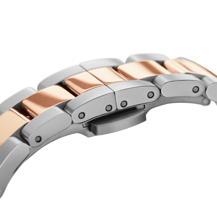Two-tone link bracelet close-up showing alternating rose gold and silver links