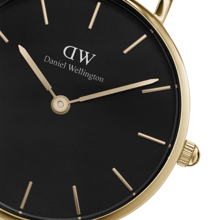 Angled view of watch face showing black dial and crown detail