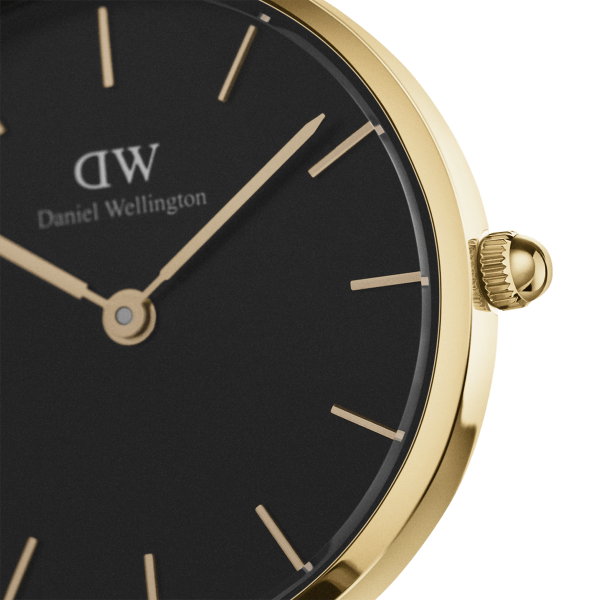 Close-up of black dial with gold hour markers, Daniel Wellington branding, and gold hands