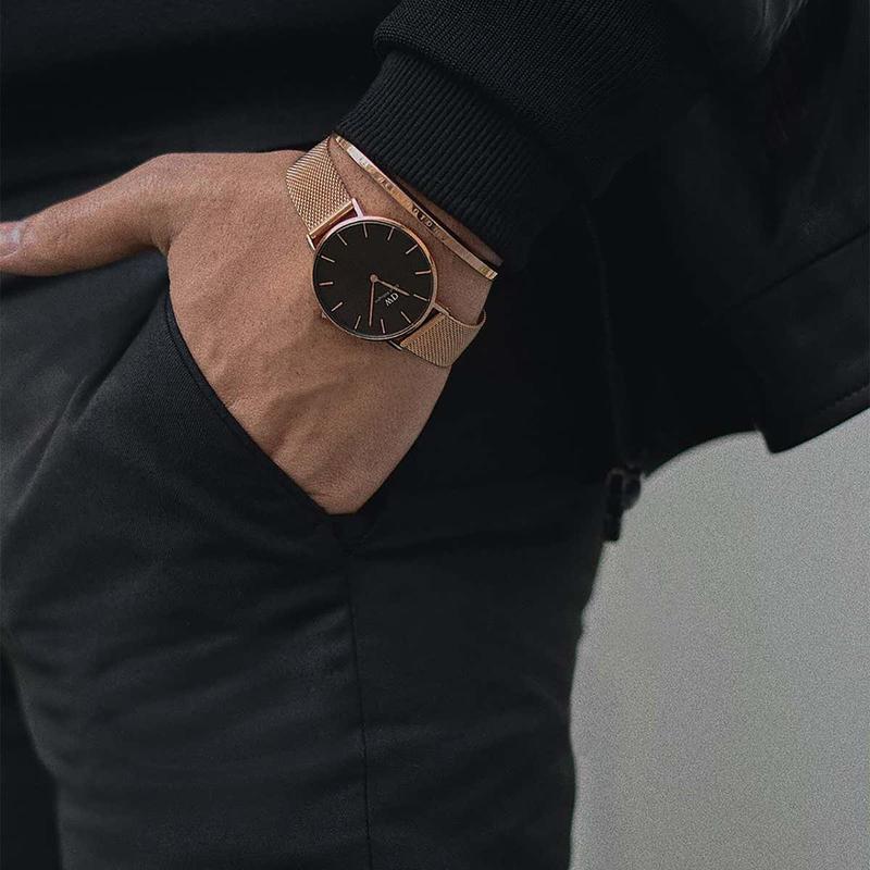 Daniel Wellington Petite Melrose 36mm watch worn on wrist with rose gold mesh strap