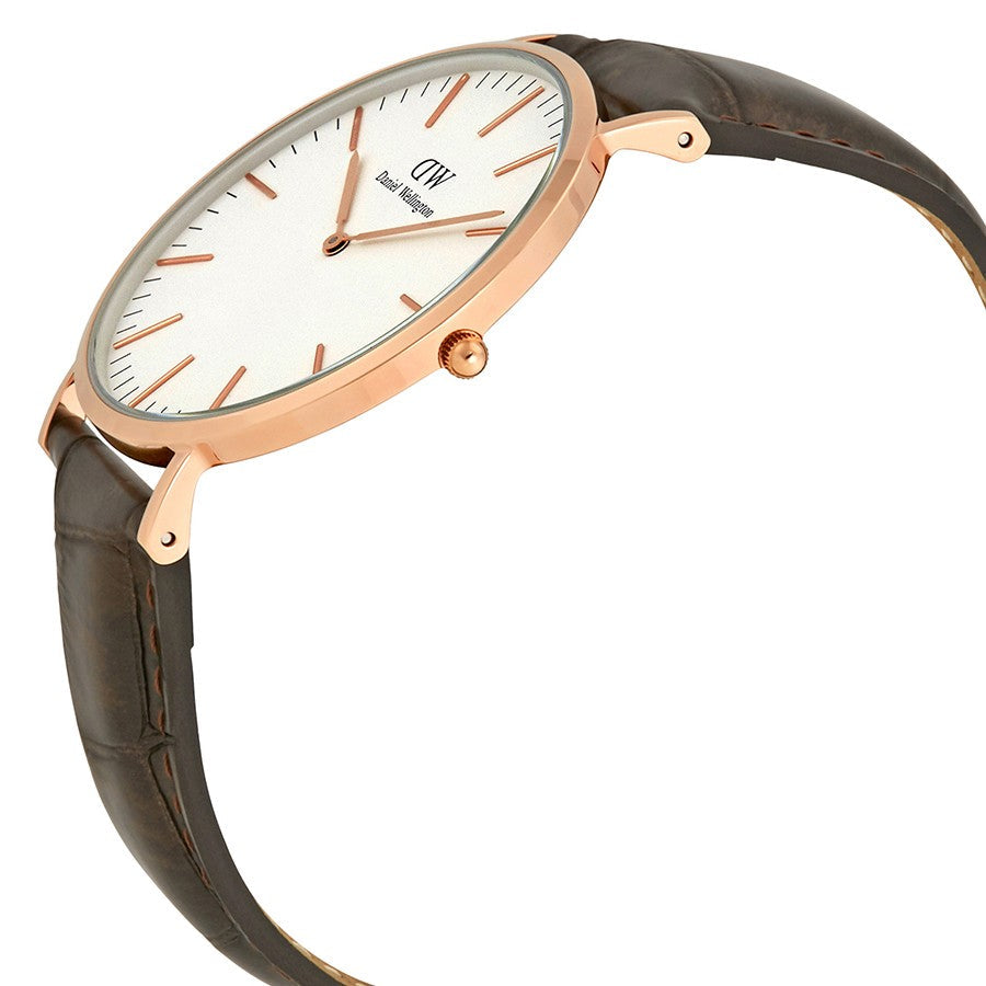 Side angle view of DW York 40mm watch showing rose gold case, white dial, and dark brown leather band