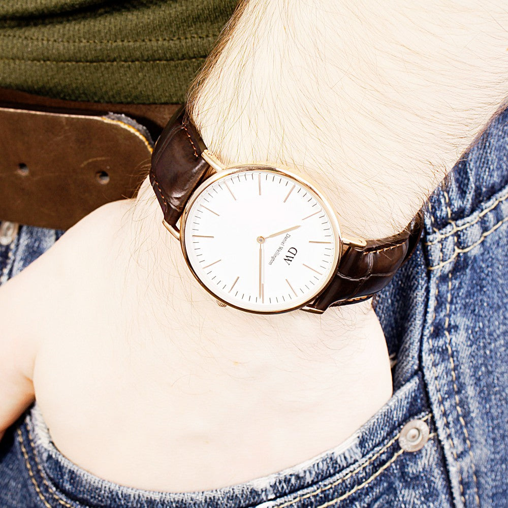 Daniel Wellington York white dial watch worn on wrist with dark brown leather strap