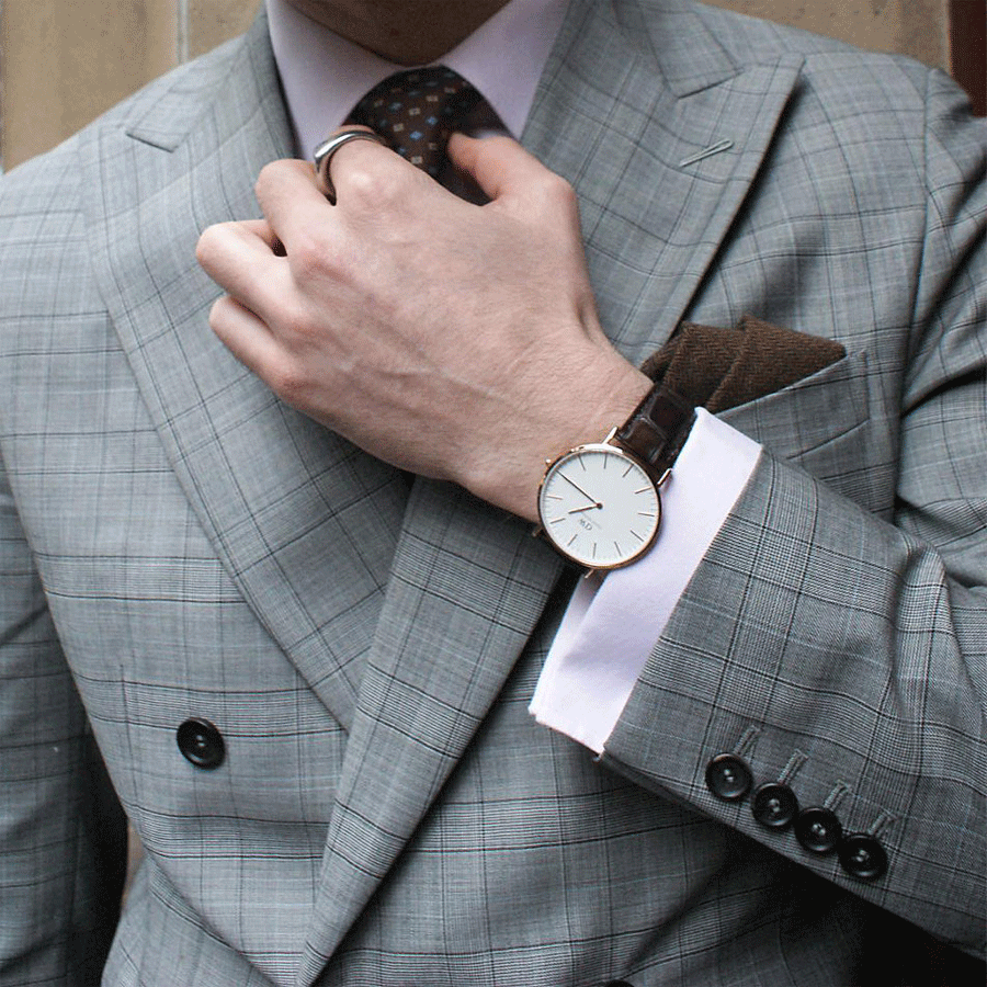 DW York 40mm watch worn on wrist styled with formal attire and brown leather accessories