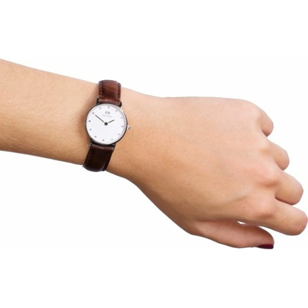Daniel Wellington Classy St Mawes women's watch on wrist displaying white dial and brown leather strap