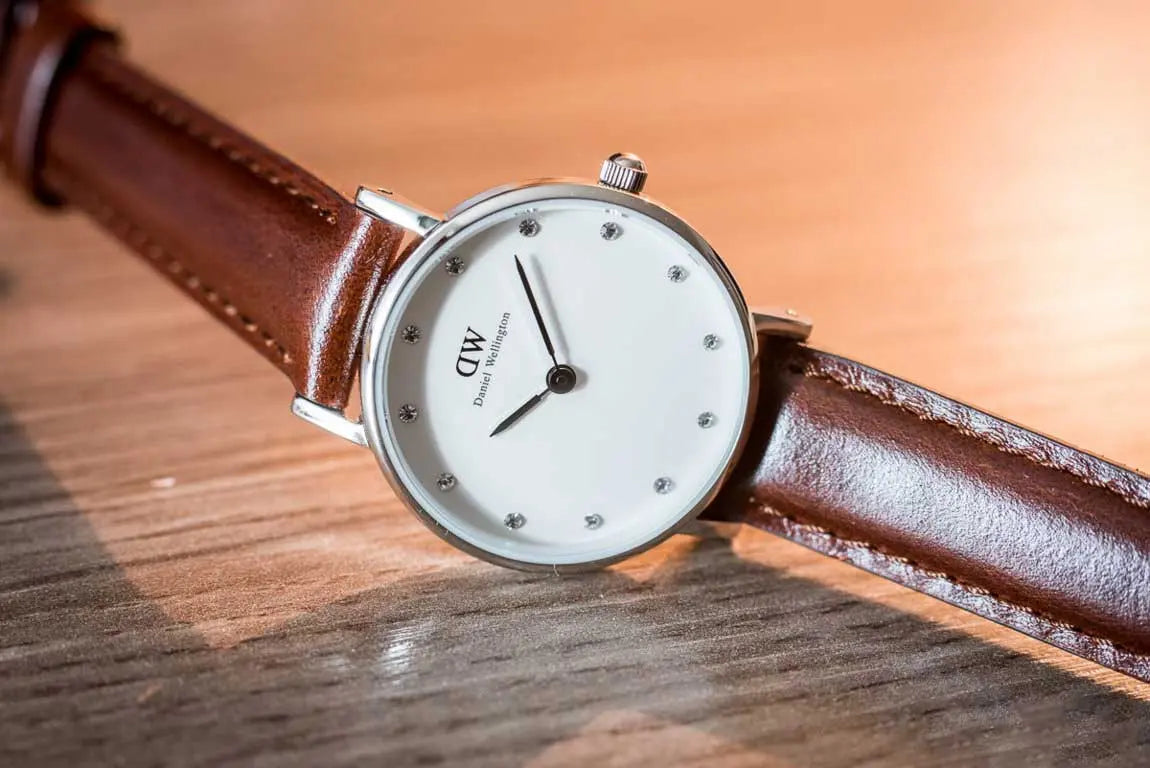 Daniel Wellington Classy St Mawes watch worn on wrist with brown leather band