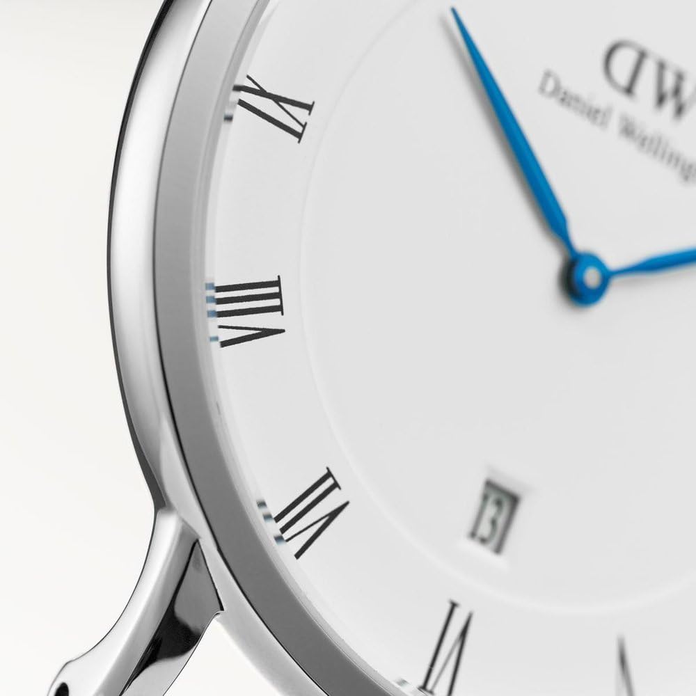 Close-up of Dapper Cornwall dial showing roman numeral indices and blue hands