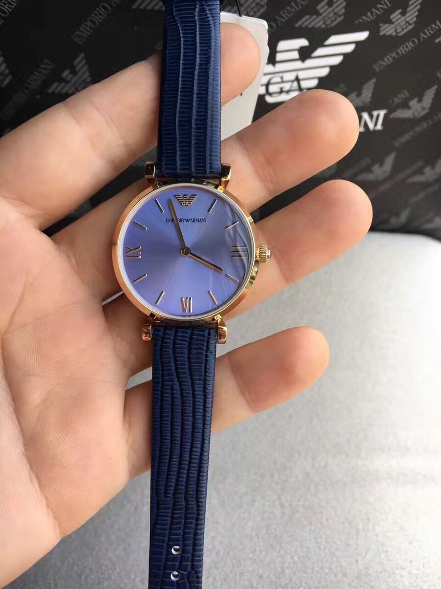 Emporio Armani AR1875 blue watch worn on wrist with navy leather strap