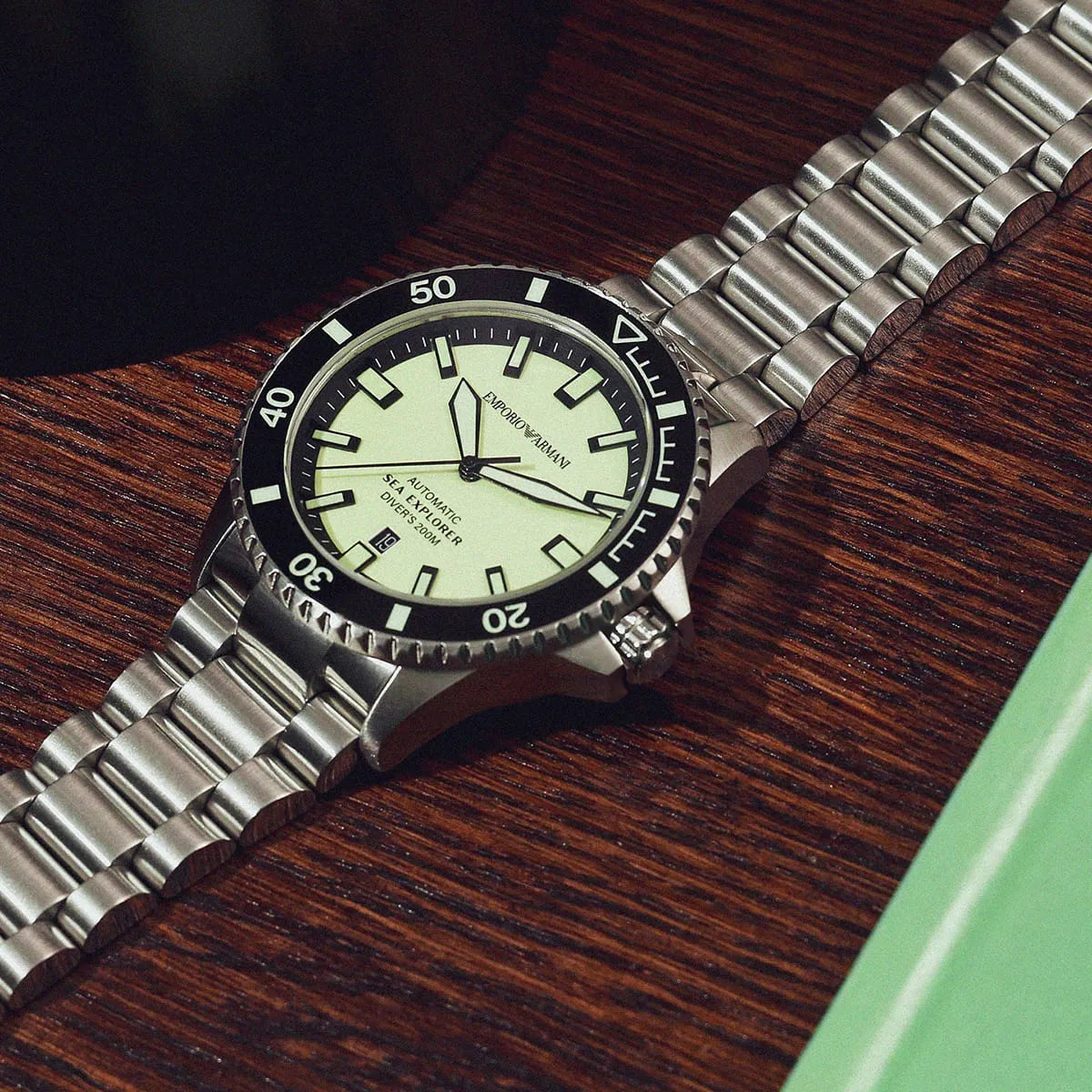 Emporio Armani Sea Explorer diver watch on wrist showing pale yellow dial and proportions