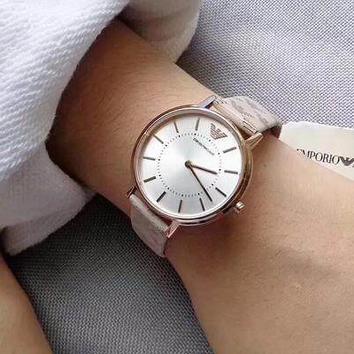 Emporio Armani AR80007 women's watch worn on wrist with rose gold case and multicolor strap