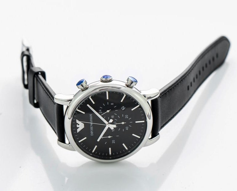 Emporio Armani AR8029 chronograph watch on wrist with black leather strap and silver case