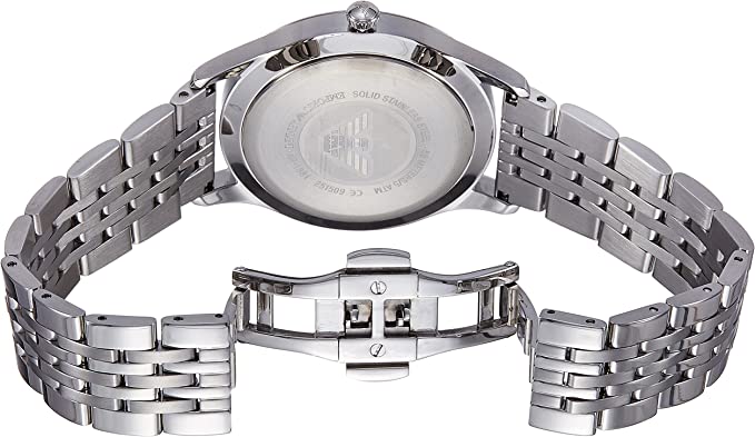 Watch bracelet closure and caseback detail showing stainless steel construction