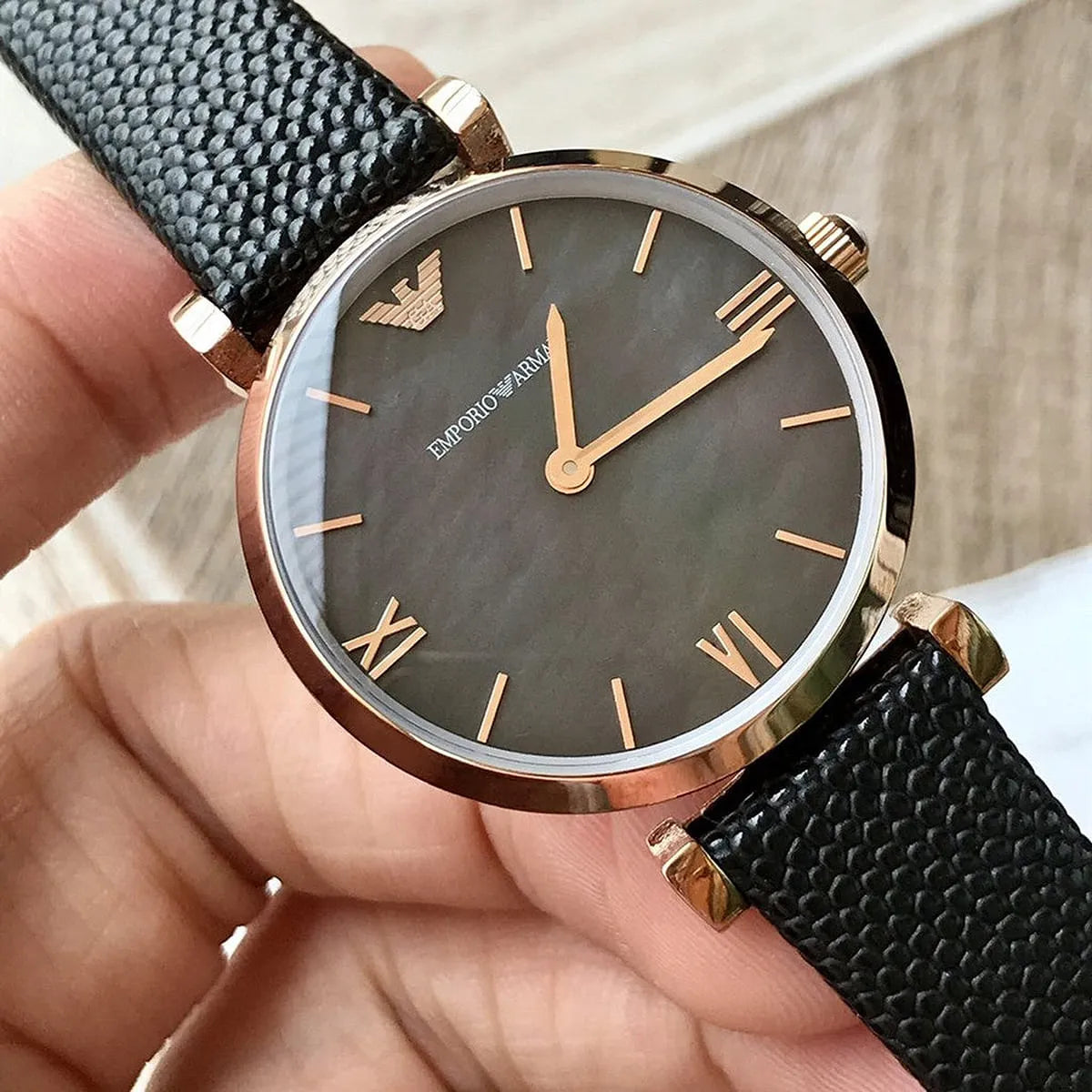 Close-up of Gianni T-Bar dial showing Roman numerals and rose gold hands