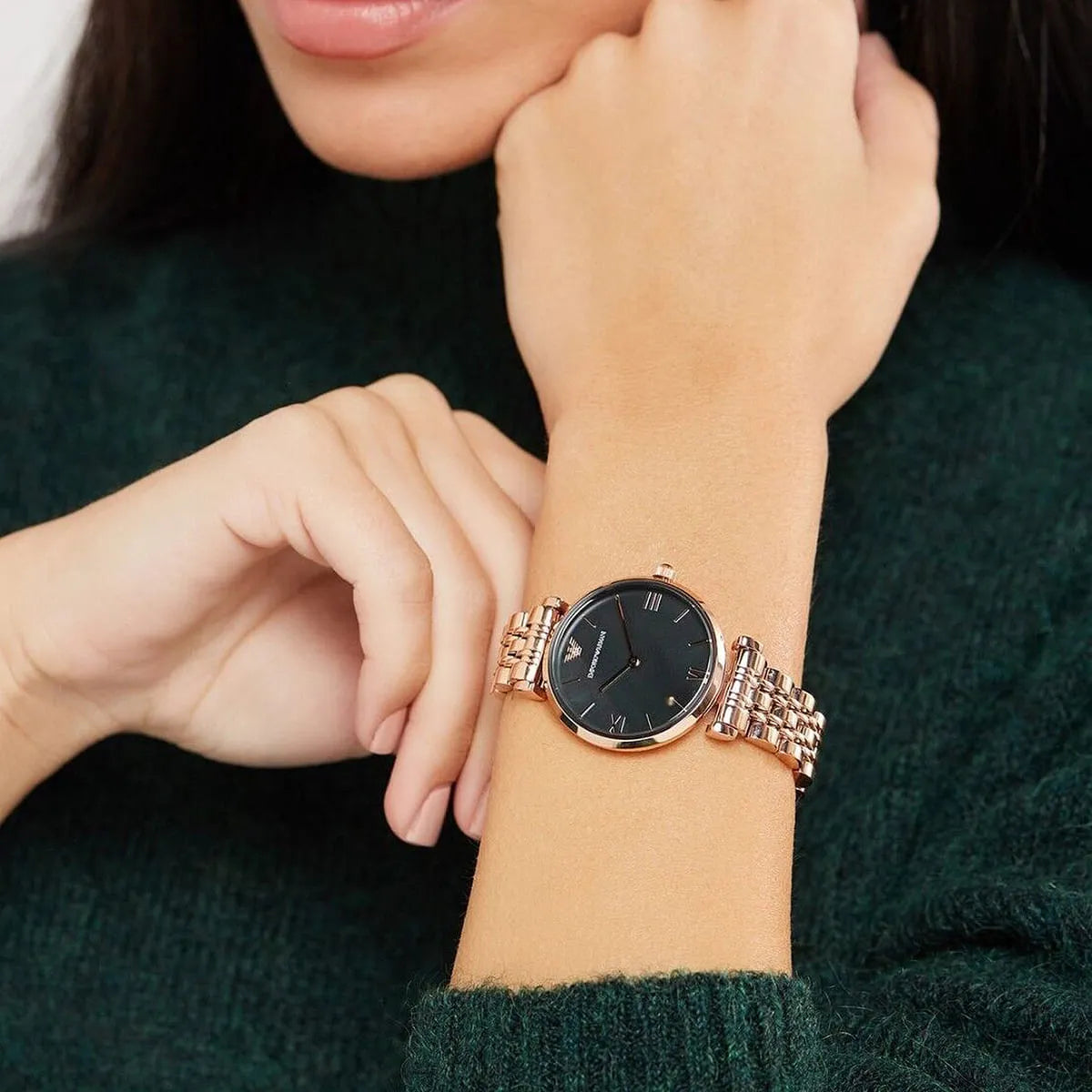Emporio Armani Gianni T-Bar watch worn on woman's wrist