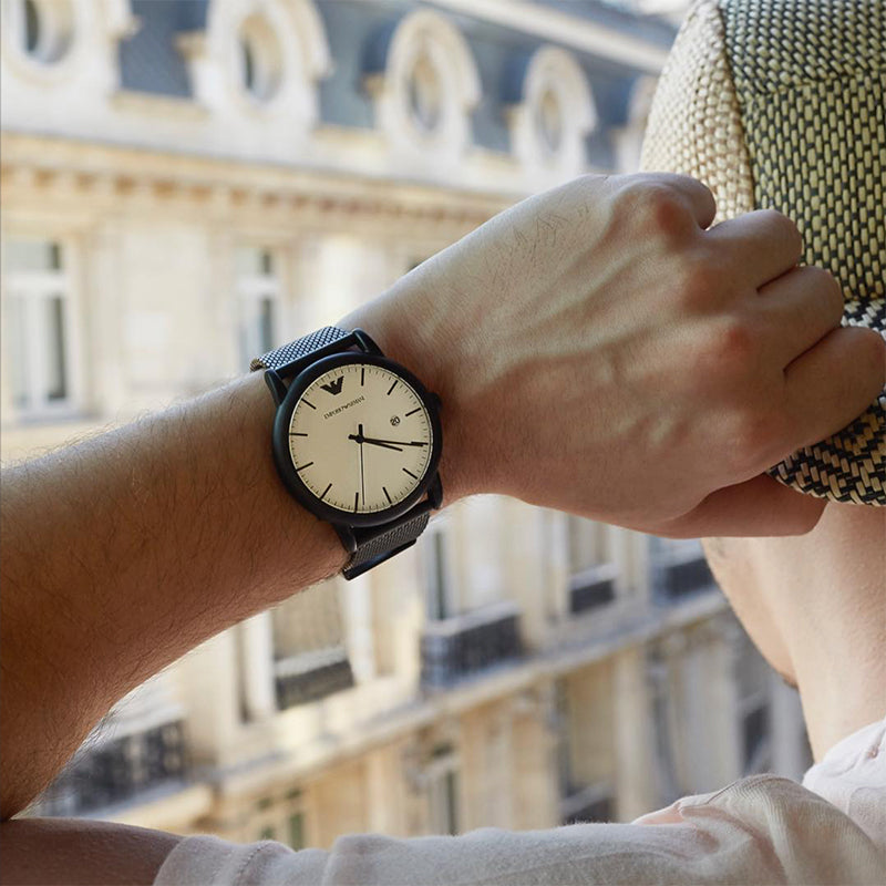 Emporio Armani Luigi watch on wrist displaying white dial and black case detail