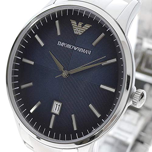 Close-up of blue sunburst dial with Emporio Armani branding and hour markers