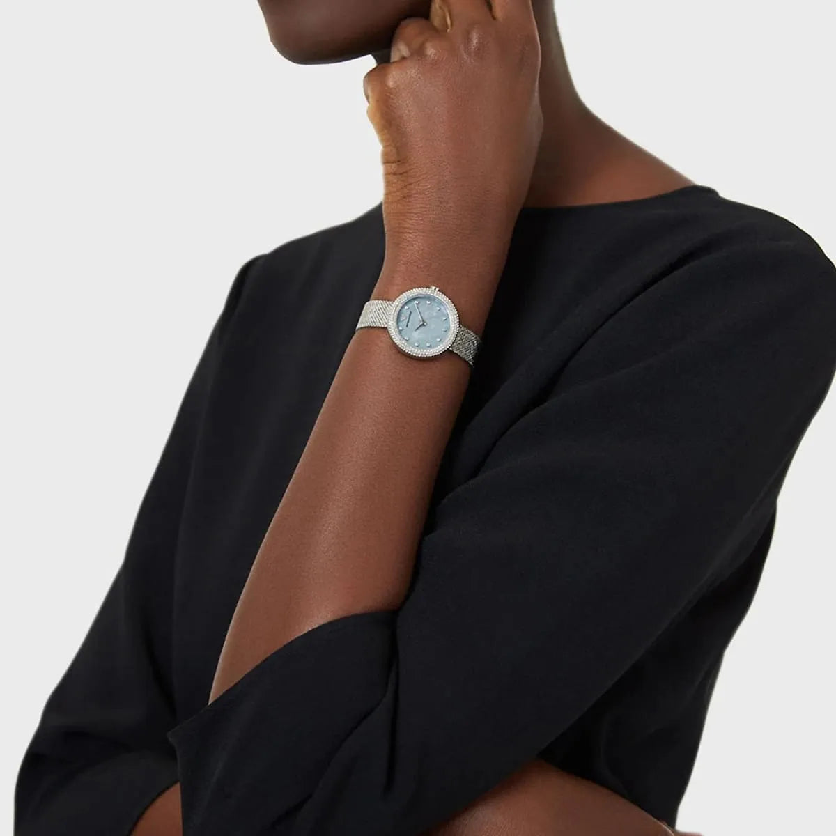 Emporio Armani Rosa watch worn on wrist with blue dial and silver mesh band