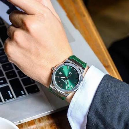 Ferragamo F-80 Classic watch on wrist with green silicone strap and steel case