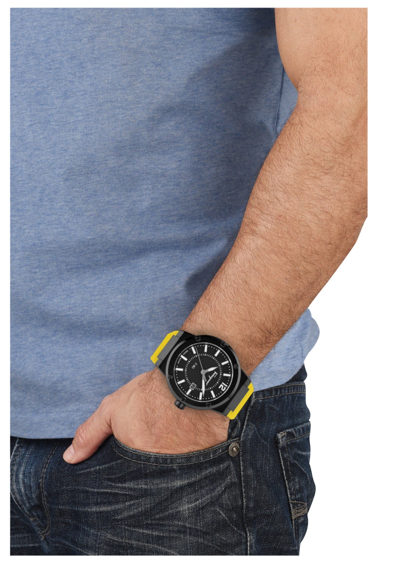 Ferragamo F-80 watch on men's wrist with yellow rubber strap