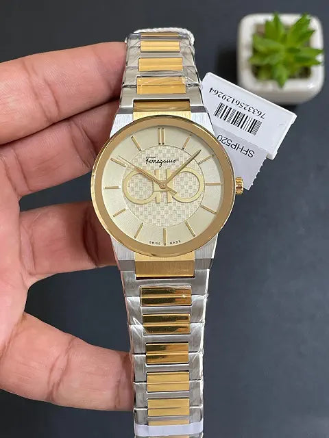 Ferragamo SFHP520 two-tone watch on wrist with tag attached, showing full bracelet