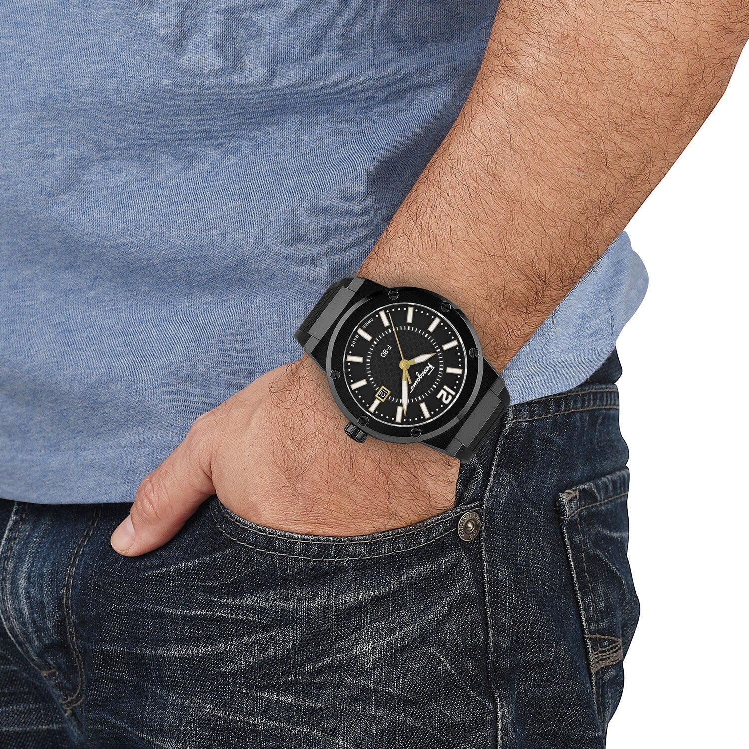 Ferragamo F-80 black quartz watch worn on wrist with blue shirt and jeans
