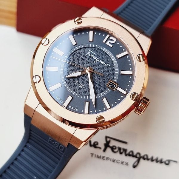 Ferragamo F-80 timepiece with rose gold bezel, brown dial, and black silicone strap