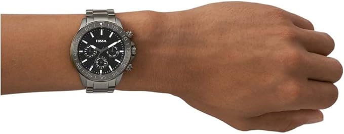 Fossil Bannon multifunction chronograph watch worn on wrist with gunmetal steel bracelet