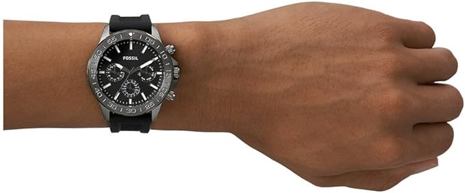 Fossil Bannon watch worn on wrist with black silicone strap