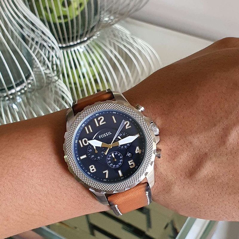 Fossil Bowman chronograph watch worn on wrist with brown leather strap