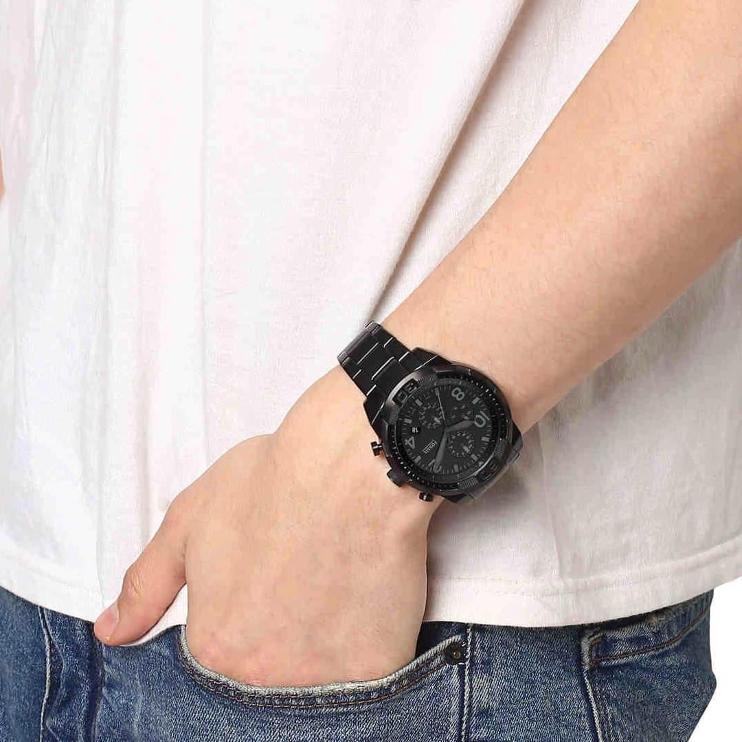 Fossil Bowman chronograph worn on wrist with black stainless steel case and bracelet