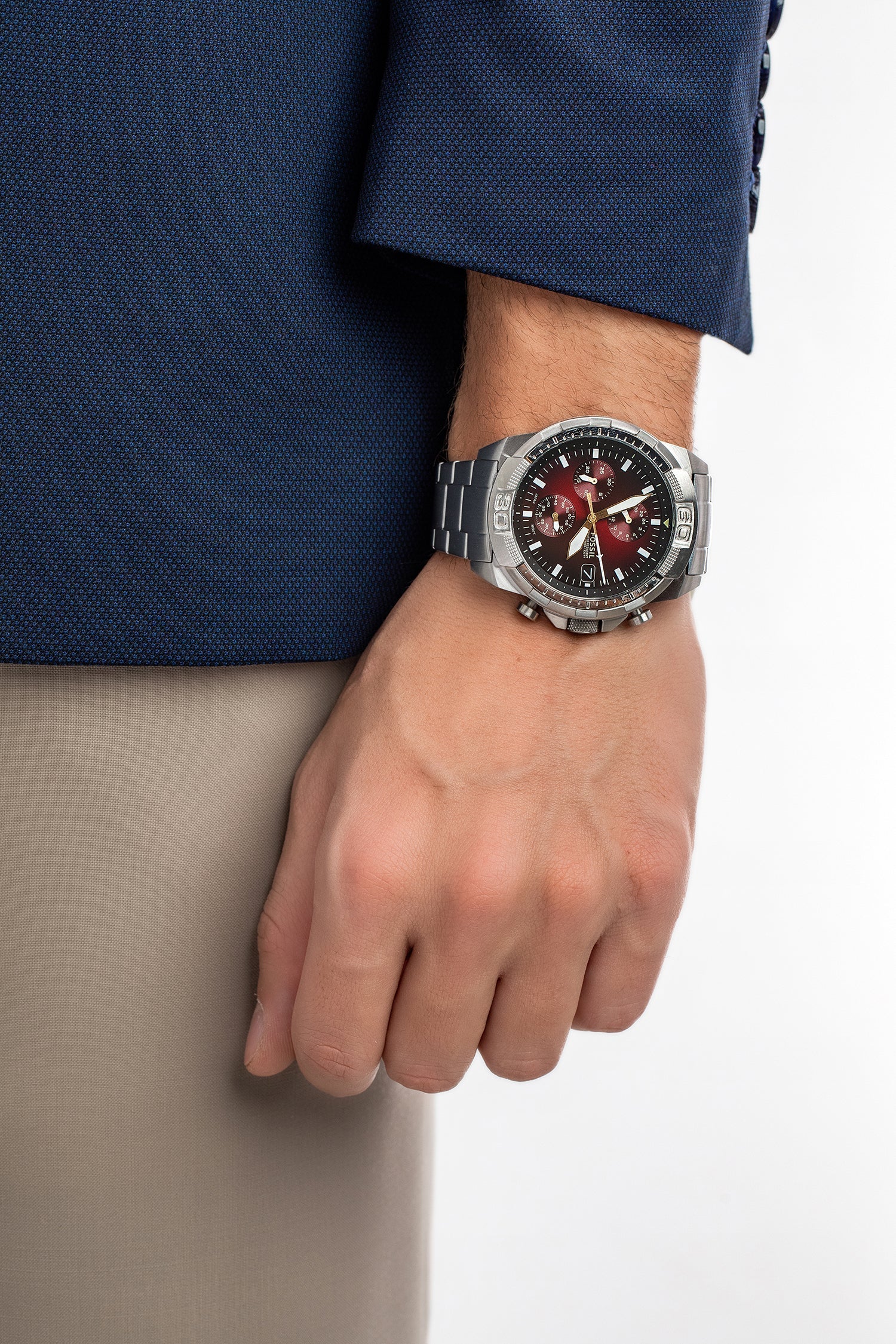 Fossil Bronson silver chronograph watch worn on wrist with burgundy dial and date display