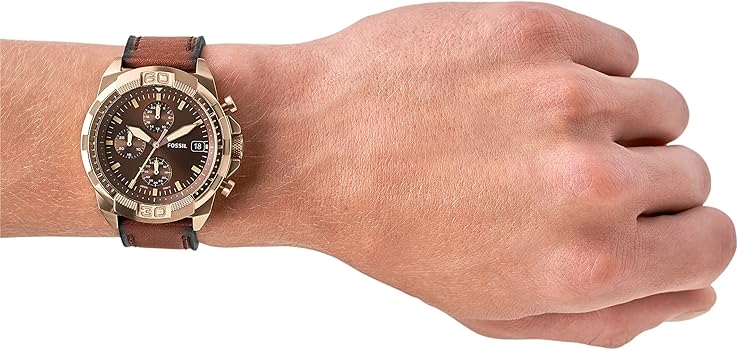 Fossil Bronson chronograph watch worn on wrist showing brown dial and rose gold case