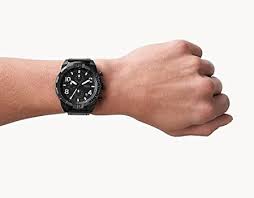 Fossil Bronson black chronograph watch worn on wrist showing dial and strap detail