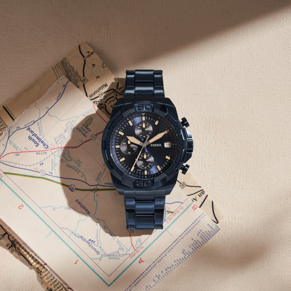 Fossil Bronson chronograph watch worn on wrist displayed on map background