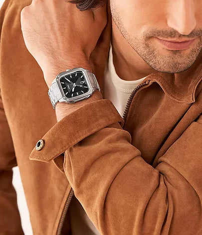 Fossil Bronson chronograph watch worn on wrist with tan leather jacket