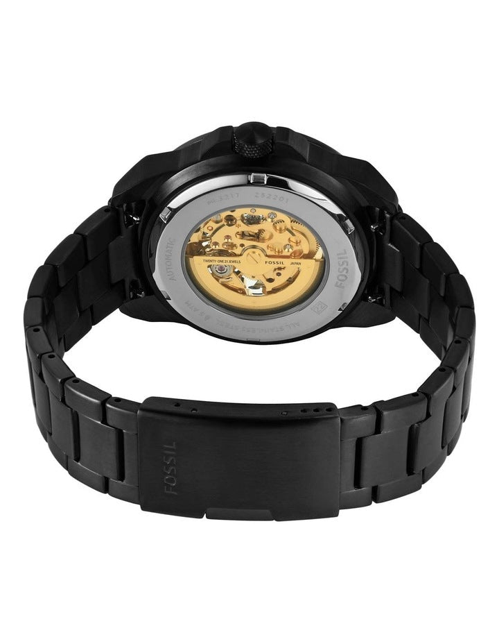 Fossil Bronson caseback showing exposed gold-tone automatic movement visible through crystal