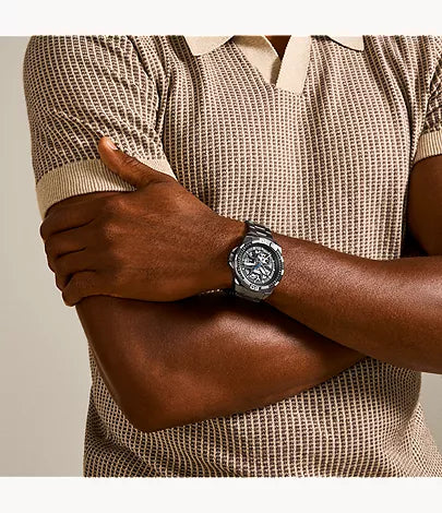 Fossil Bronson ME3218 skeleton watch on wrist with black dial and gunmetal stainless steel band