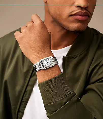 Fossil Carraway FS6008 stainless steel watch worn on men's wrist with rectangular case and metal band