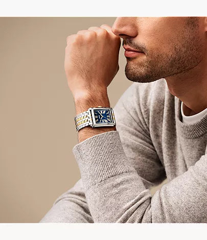 Fossil Carraway watch on wrist showing blue dial and two-tone metal bracelet