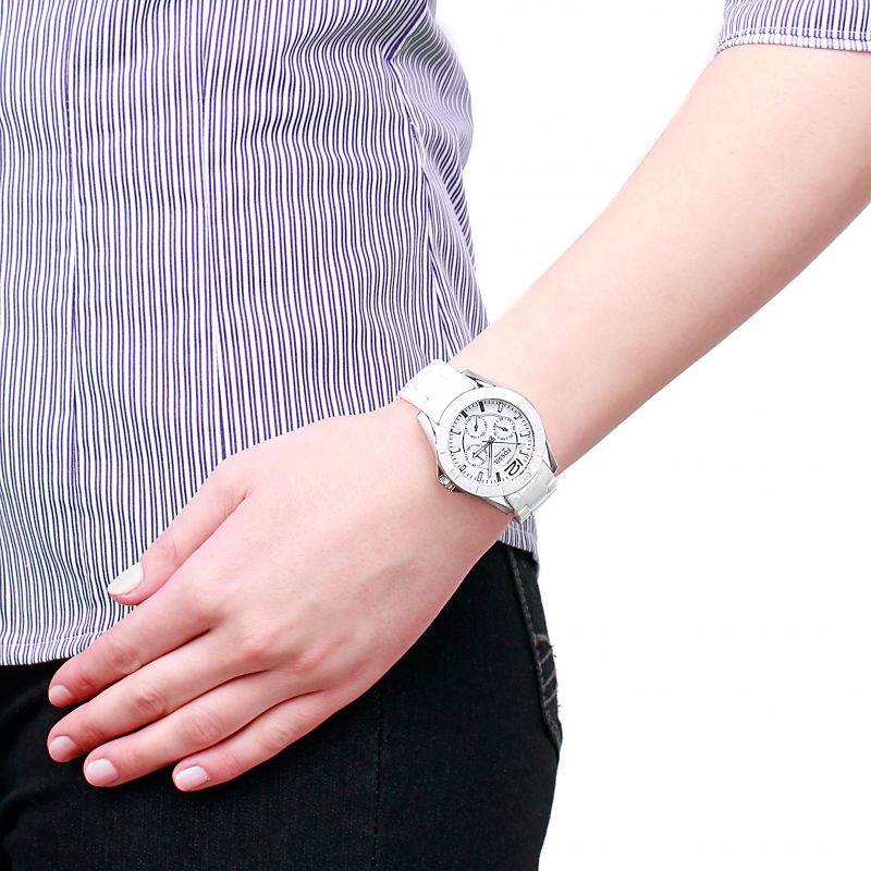Fossil CE1002 white ceramic ladies watch worn on wrist with light blue chronograph dial