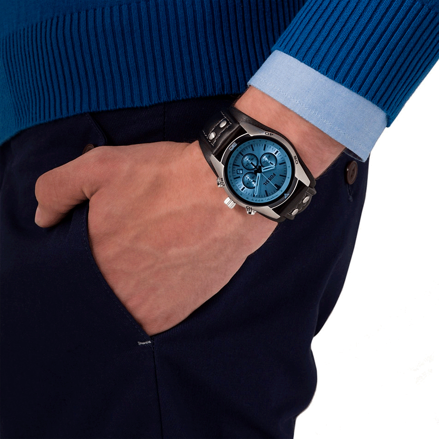 Fossil CH2564 watch on wrist with blue chronograph dial in casual setting