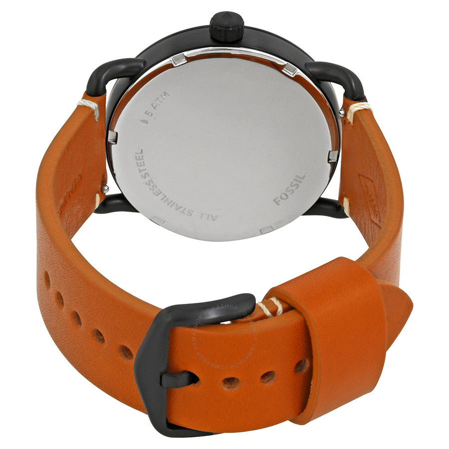 Fossil Commuter caseback showing stainless steel back plate and brown leather strap with buckle